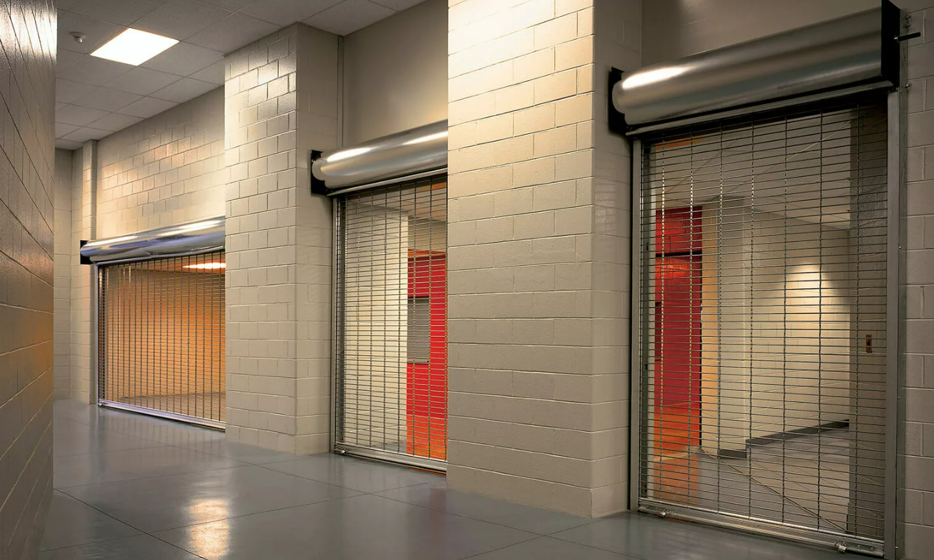 Team of professionals conducting commercial garage door repair in Johnstown, Ohio, using specialized tools and equipment