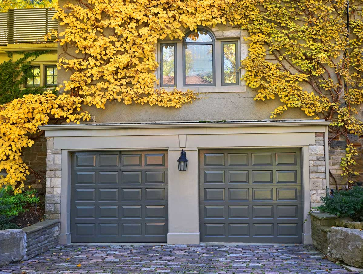 Custom-designed garage door with high-quality materials and unique hardware, installed in a home in Johnstown, Ohio, showcasing the craftsmanship by Johnstown Ohio Garage Door Repair services.
