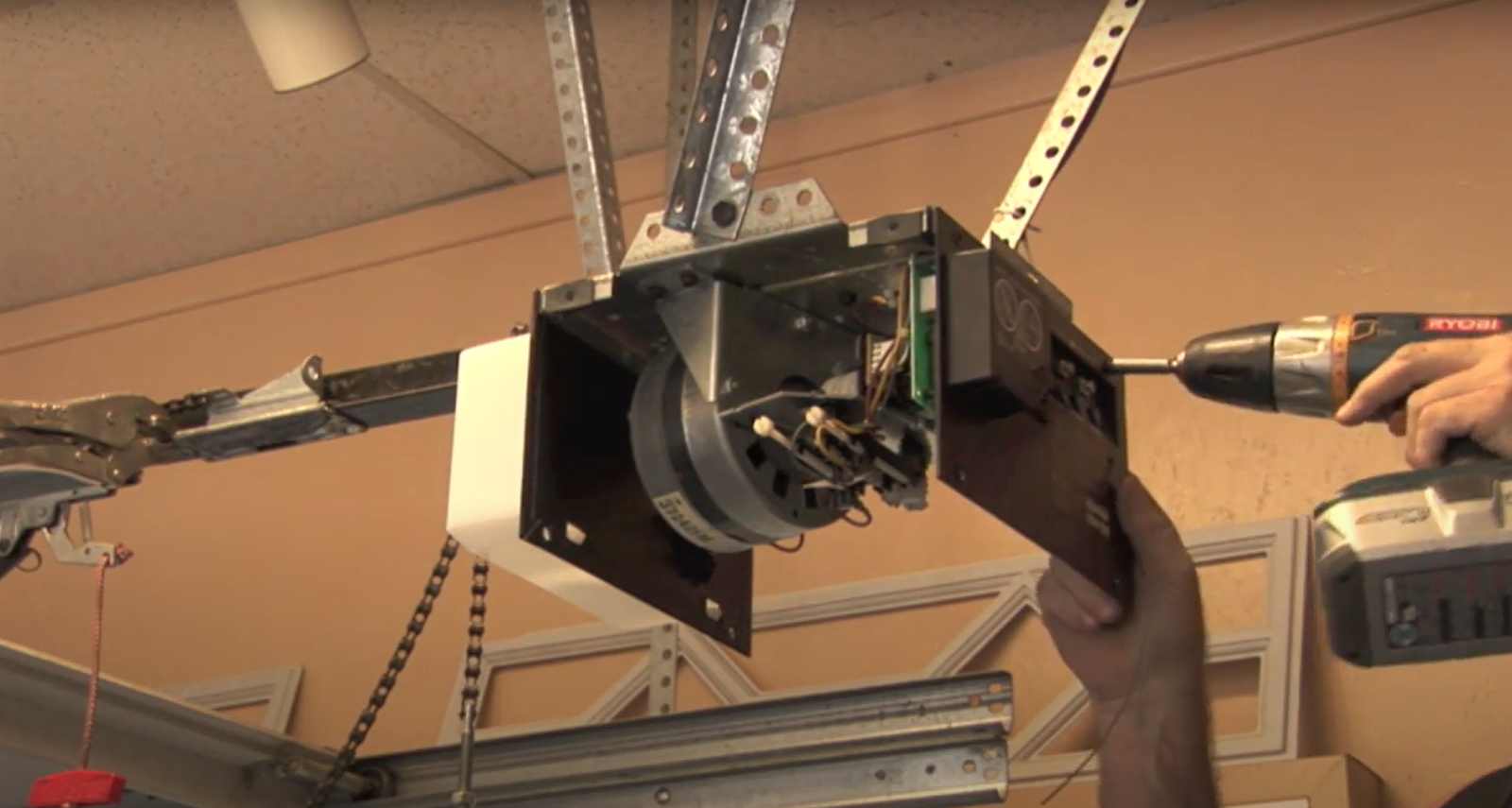 Close-up of a technician repairing a garage door opener in Johnstown, Ohio, highlighting expert garage door opener repair services
