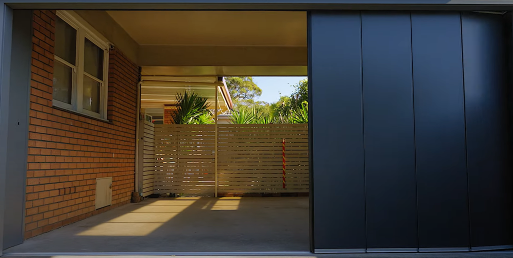 Custom-designed garage door installation in Johnstown, Ohio featuring unique woodwork and modern, energy-efficient design.