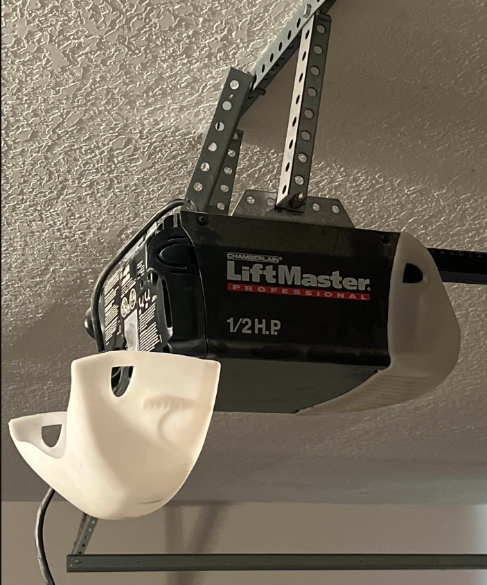 Professional technician repairing a garage door opener in Johnstown, Ohio, showcasing expert garage door opener repair services.