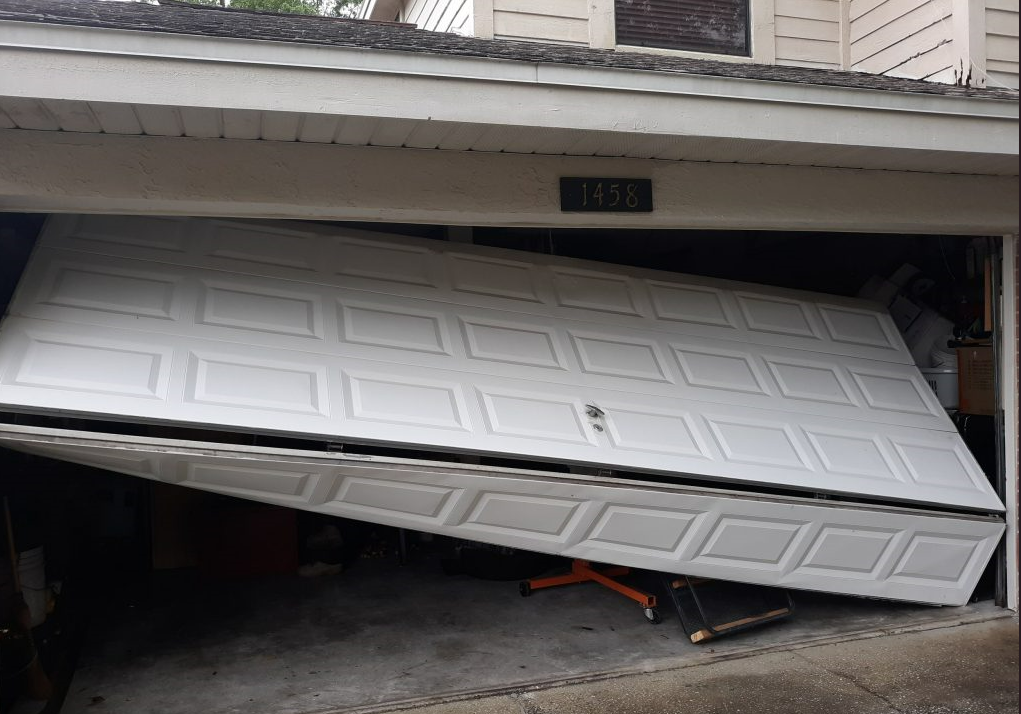 Professional technician performing a garage door section replacement with precision and care, showcasing Johnstown Ohio Garage Door Repair's expertise in service