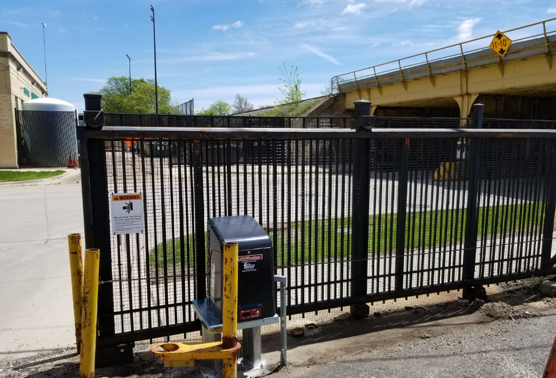 Team of professionals performing commercial gate repair at Johnstown Ohio Garage Door Repair, showcasing high-quality service and repair process.