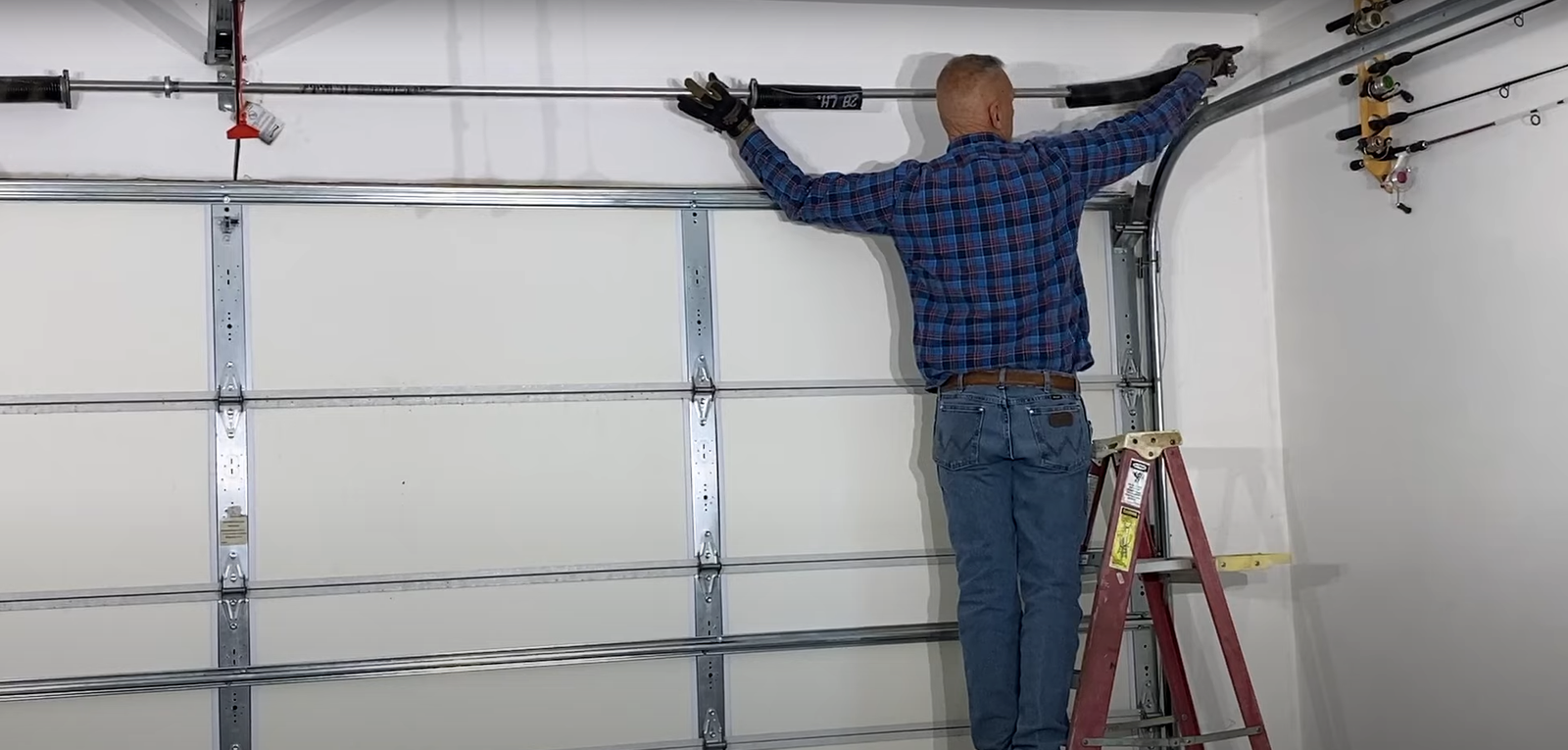 Professional technician performing garage door spring repair at Johnstown Ohio Garage Door Repair, highlighting expert maintenance services