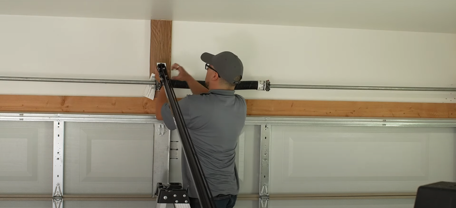 Professional technician performing garage door spring repair at Johnstown Ohio Garage Door Repair, highlighting expert maintenance services