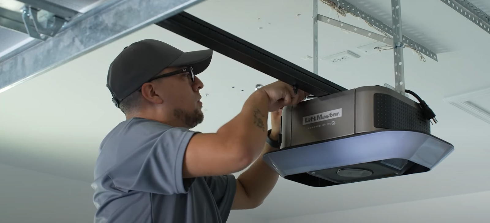 Close-up of a technician repairing a garage door opener in Johnstown, Ohio, highlighting expert garage door opener repair services